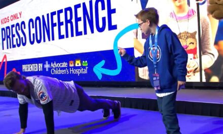 Young fan accepts Wisdom’s challenge to a push-up contest: ‘Bring it on!’