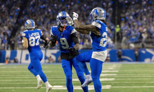 Jameson Williams lets Jordan Addison know Detroit Lions receivers are best