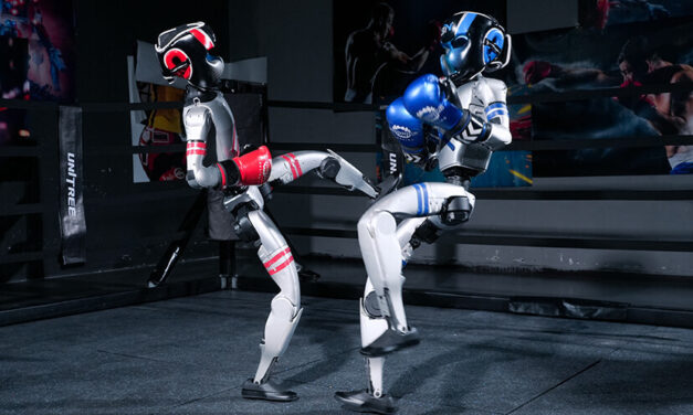 In world’s first humanoid boxing match, gloating robot face plants