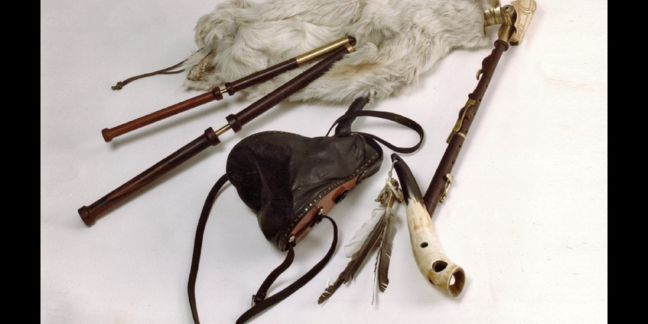 Inventor plays homemade electromagnetic bagpipes in rock band