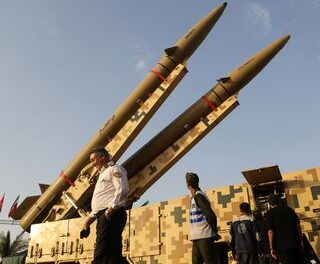 Iran launches missiles at U.S. base for first time since Trump paused strikes