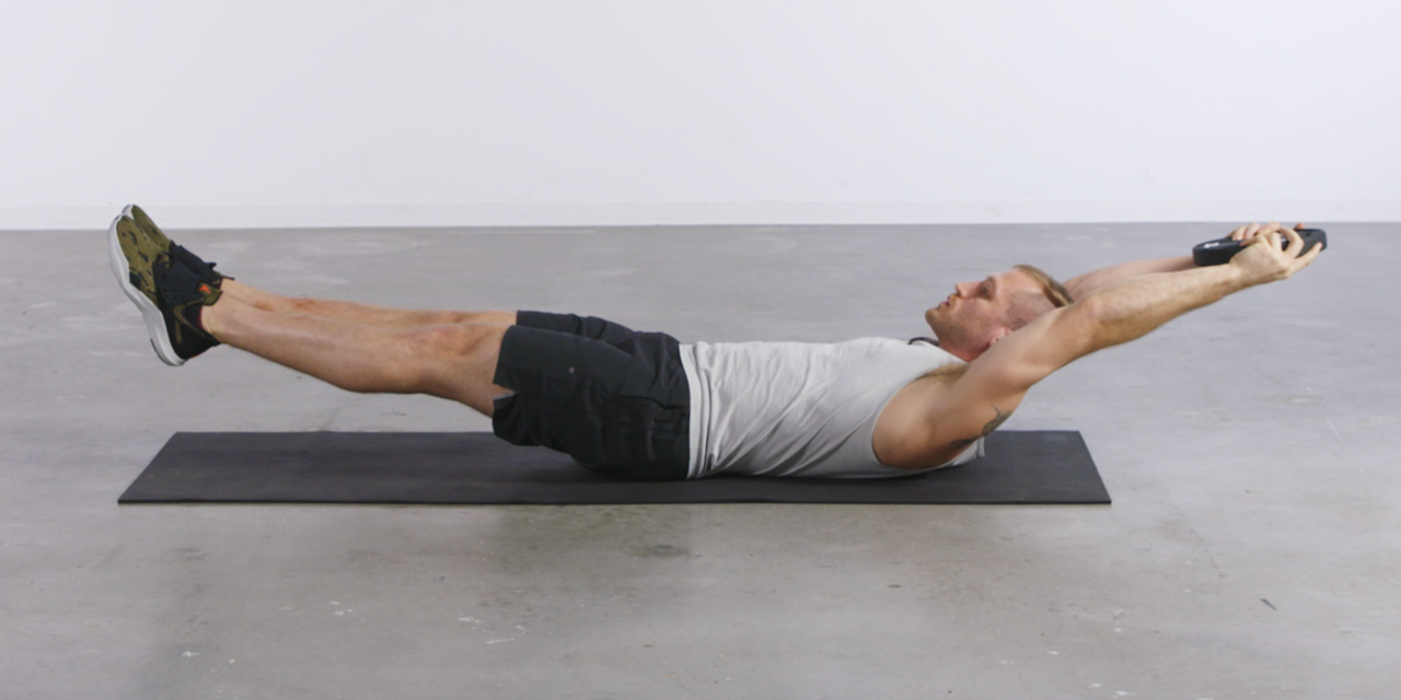How to Master the Hollow Hold for a Stronger Set of Abs